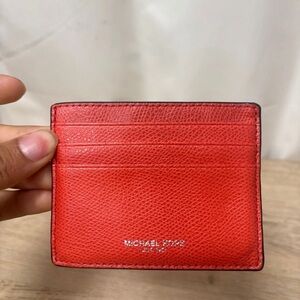 Woman’s Michael kors coral ID card wallet